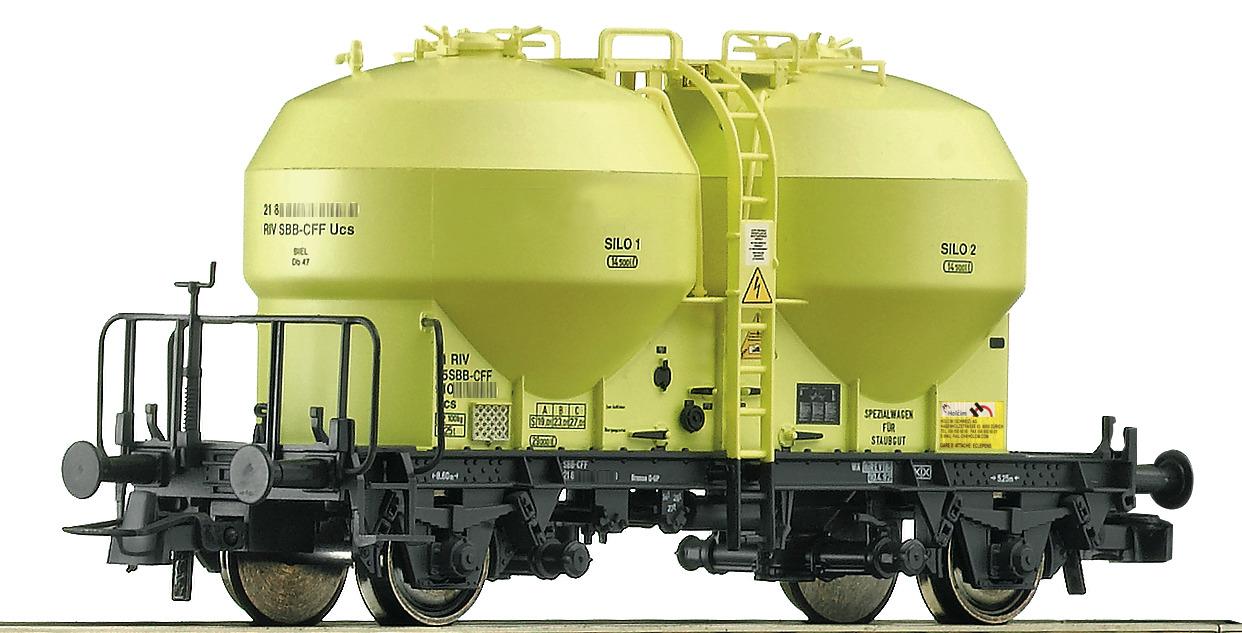 Ucs jaune "Holcim" avec logo et inscriptions "SBB CFF FFS" sur un silo