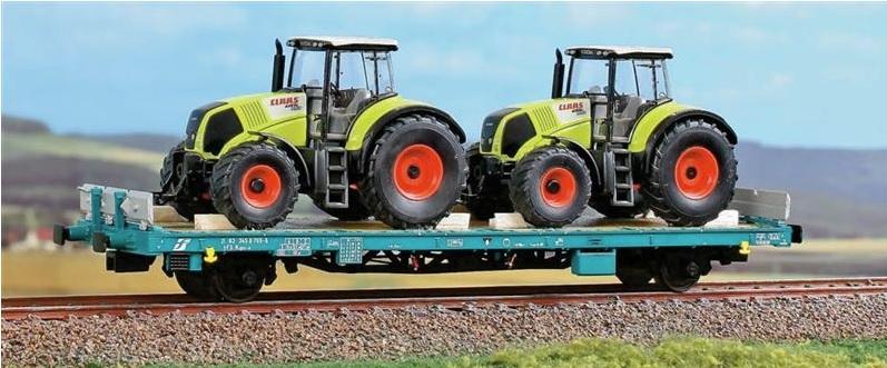 Wagon plat type Kgps avec chargement de tracteurs